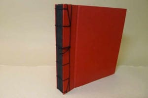 Álbum de fotos de tela lisa roja con costura japonesa